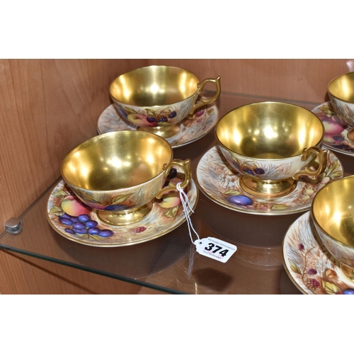 374 - SEVEN AYNSLEY ORCHARD GOLD TEACUPS AND SAUCERS, each teacup with gilt interior, rim, handle and foot... 