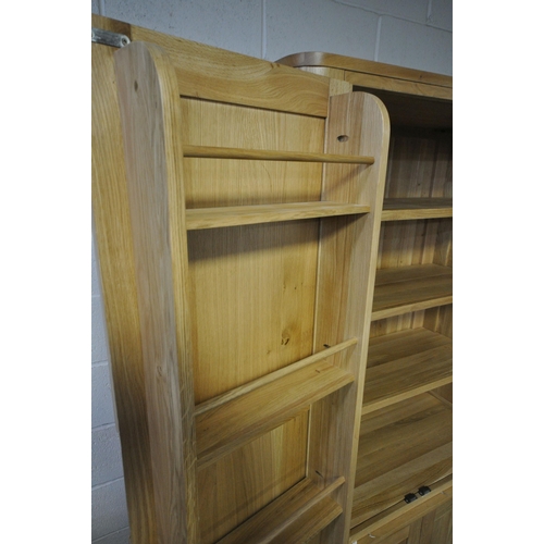 151 - AN OAK FURNITURE LAND ROMSEY NATURAL SOLID OAK LARGE LARDER, with two sets of double doors, the top ... 