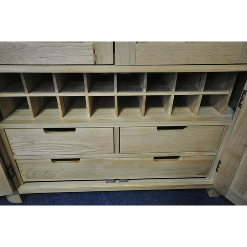 151 - AN OAK FURNITURE LAND ROMSEY NATURAL SOLID OAK LARGE LARDER, with two sets of double doors, the top ... 