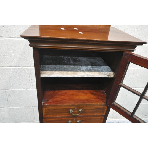 161 - AN EDWARDIAN MAHOGANY MUSIC CABINET, with a raised back, the single door with six glass panes, above... 