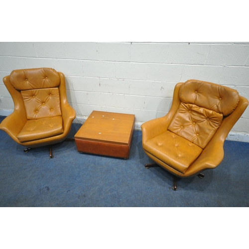 167 - A PAIR OF TANNED LEATHERETTE ROCKING WING BACK ARMCHAIRS, with buttoned head rest, back rest and sea... 