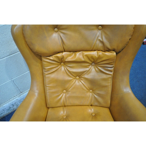 167 - A PAIR OF TANNED LEATHERETTE ROCKING WING BACK ARMCHAIRS, with buttoned head rest, back rest and sea... 