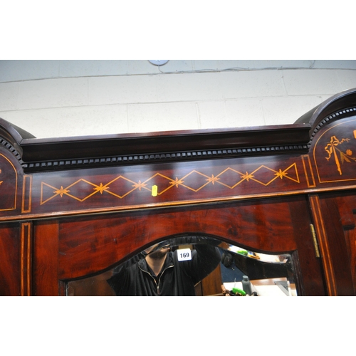 169 - AN EDWARDIAN MAHOGANY, MARQUETRY INLAID AND BOX STUNG BEDROOM SUITE, comprising a triple door compac... 