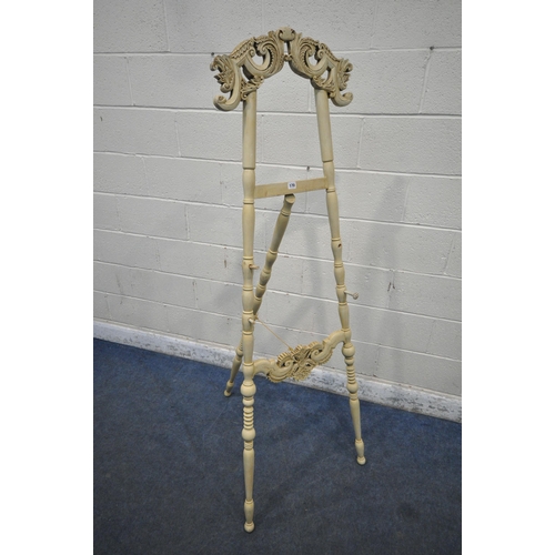 170 - A FRENCH STYLE CREAM PAINTED ARTIST EASEL, with scrolled and foliate designs, height 178cm, conditio... 