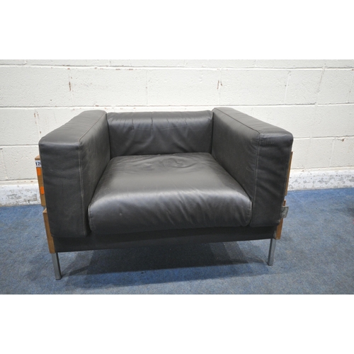 176 - A ROBIN DAY FOR HABITAT 'FORUM' ARMCHAIR, with an oak frame, raised on tubular metal legs, 93cm x de... 