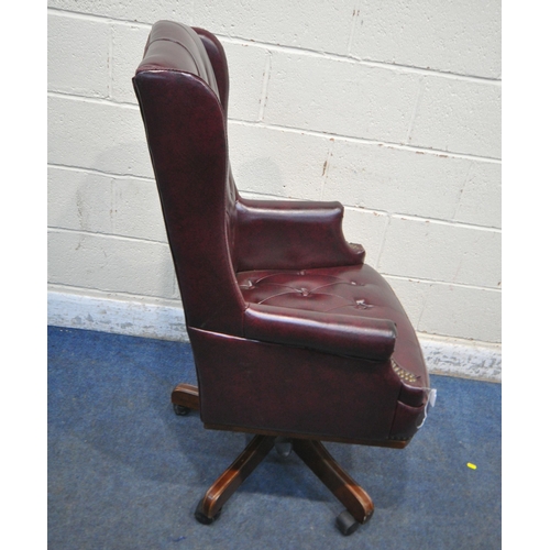 179 - A BURGUNDY LEATHERETTE SWIVEL OFFICE CHAIR, width 69cm x depth 72cm x height 115cm, condition report... 