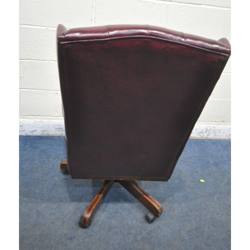 179 - A BURGUNDY LEATHERETTE SWIVEL OFFICE CHAIR, width 69cm x depth 72cm x height 115cm, condition report... 