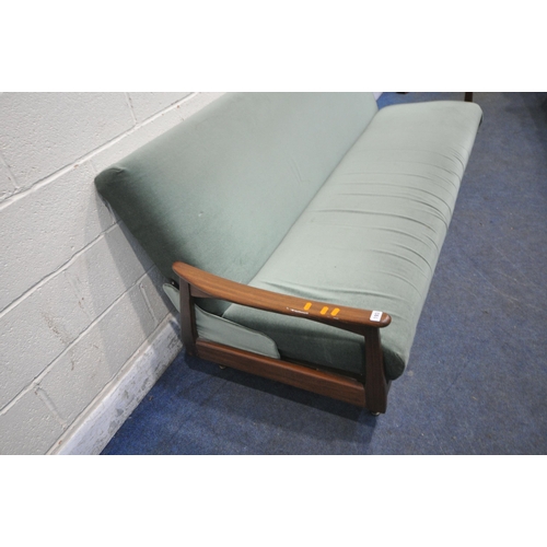 193 - A MID CENTURY TEAK FRAME SOFA BED, with green fabric upholstery, swept open armrests raised on taper... 