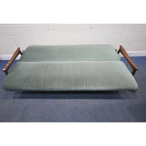 193 - A MID CENTURY TEAK FRAME SOFA BED, with green fabric upholstery, swept open armrests raised on taper... 