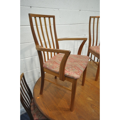 194 - A MID CENTURY G PLAN TEAK OVAL EXTENDING TABLE, with a single fold out leaf, raised on cylindrical t... 