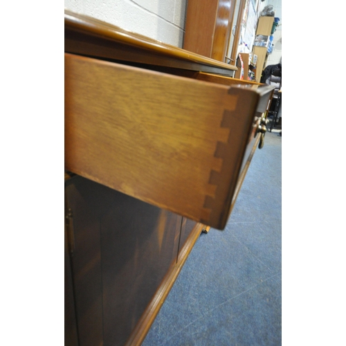 198 - A LATE 20TH CENTURY YEW WOOD CABINET, with two drawers, above double cupboard doors, width 92cm x de... 