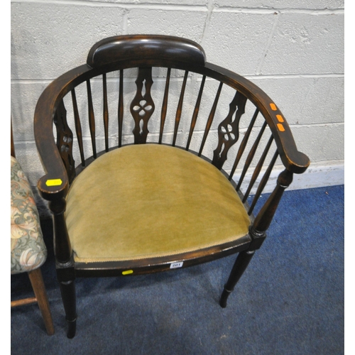 201 - A 20TH CENTURY EBONISED CHAIR, with patterned upholstery, raised on turned front legs, a bow top arm... 