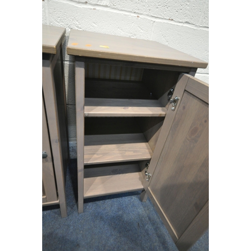 204 - AN OPPOSING PAIR OF PINE BEDSIDE CABINETS, each with a single cupboard door, 39cm squared x height 7... 