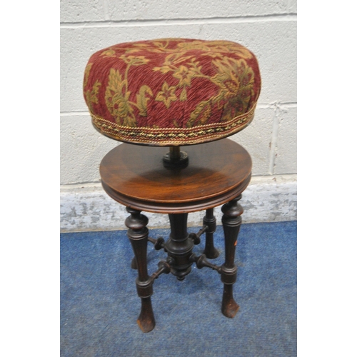 206 - A 20TH CENTURY MAHOGANY PIANO STOOL, with a rise and fall swivel seat, raised on tapered legs, unite... 