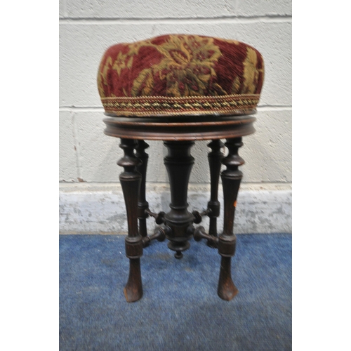 206 - A 20TH CENTURY MAHOGANY PIANO STOOL, with a rise and fall swivel seat, raised on tapered legs, unite... 