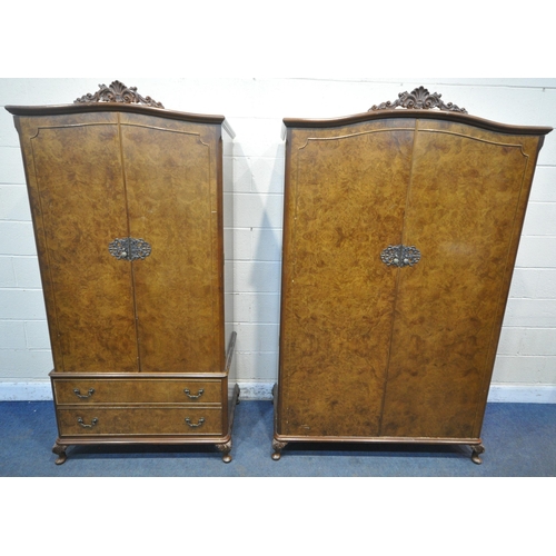 213 - TWO 20TH CENTURY QUEEN ANNE STYLE WALNUT DOUBLE DOOR WARDROBES, with foliate crests, raised on small... 