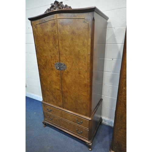 213 - TWO 20TH CENTURY QUEEN ANNE STYLE WALNUT DOUBLE DOOR WARDROBES, with foliate crests, raised on small... 