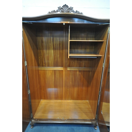 213 - TWO 20TH CENTURY QUEEN ANNE STYLE WALNUT DOUBLE DOOR WARDROBES, with foliate crests, raised on small... 