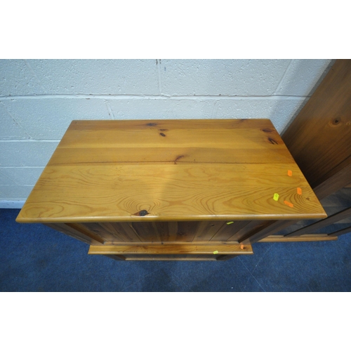 215 - THREE PIECES OF MODERN PINE FURNITURE, to include a bookcase, with two glass doors, width 87cm x dep... 