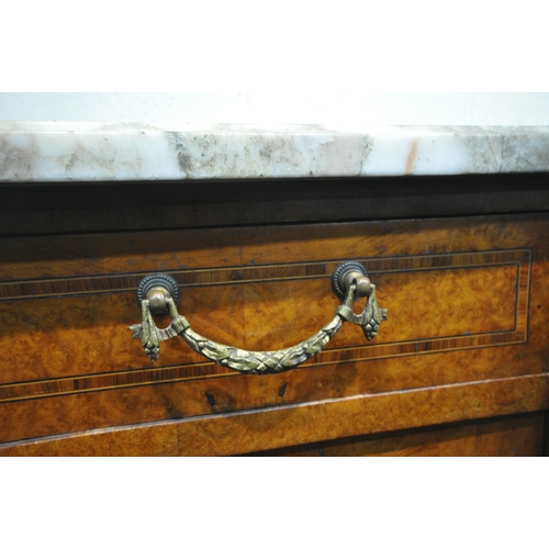 223 - A REPRODUCTION BURR WALNUT BREAKFRONT SIDEBOARD, with a marble top, three drawers, above three cupbo... 