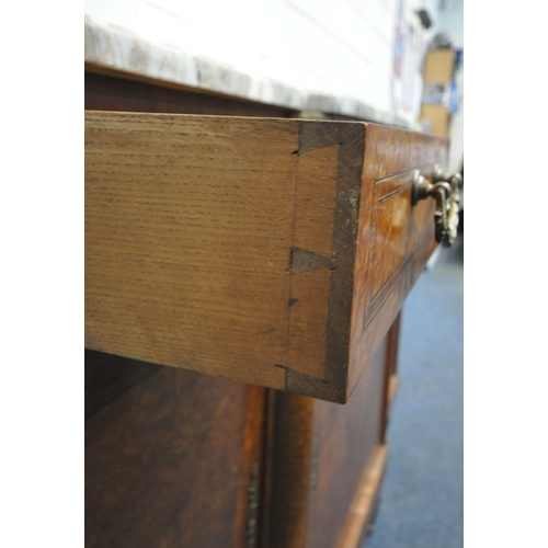 223 - A REPRODUCTION BURR WALNUT BREAKFRONT SIDEBOARD, with a marble top, three drawers, above three cupbo... 