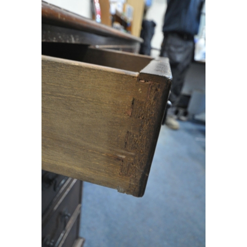 224 - A 20TH CENTURY MAHOGANY TWIN PEDESTAL DESK, with a leather writing surface, fitted with eight assort... 