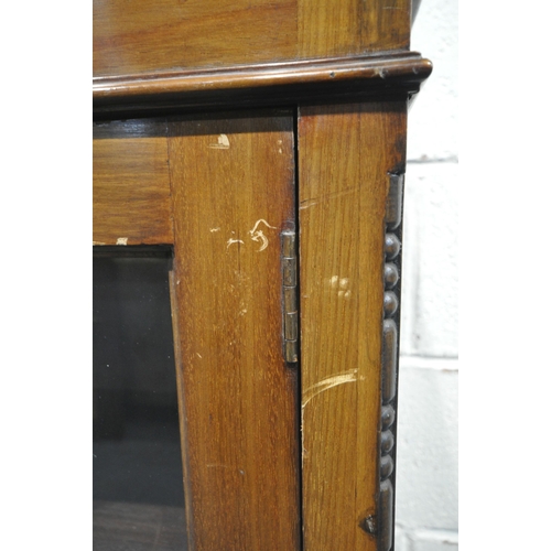 226 - A 20TH CENTURY MAHOGANY BOOKCASE, with double glazed doors, enclosing three shelves, width 121cm x d... 