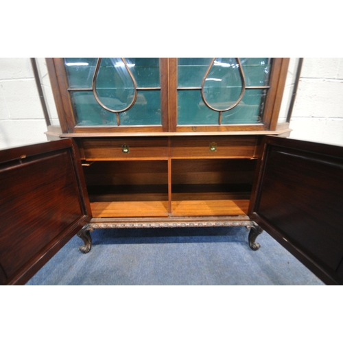 229 - AN EARLY 20TH CENTURY ROSEWOOD DISPLAY CABINET, the raised back with a foliate crest, with canted co... 