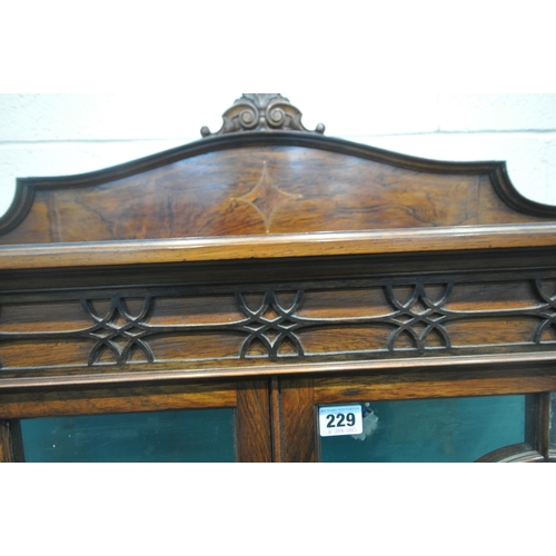 229 - AN EARLY 20TH CENTURY ROSEWOOD DISPLAY CABINET, the raised back with a foliate crest, with canted co... 