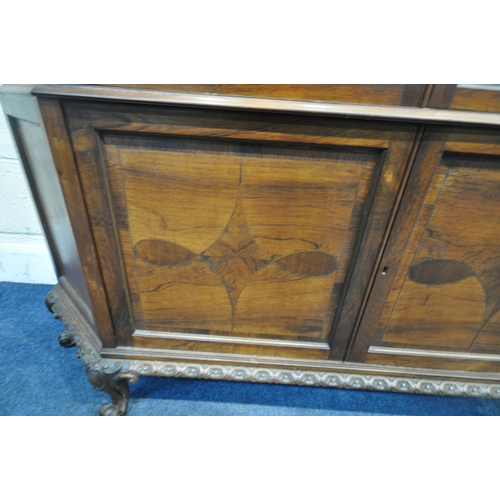 229 - AN EARLY 20TH CENTURY ROSEWOOD DISPLAY CABINET, the raised back with a foliate crest, with canted co... 