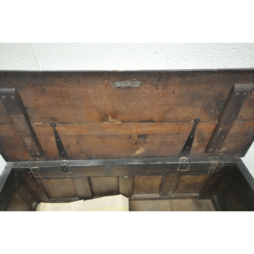 241 - A GEORGIAN OAK COFFER, with a hinged lid, the four front panels with geometric designs, width 128cm ... 