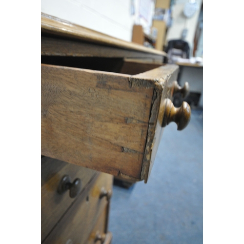 244 - A 20TH CENTURY OAK TWIN PEDESTAL DESK, with an oxblood leather writing surface, fitted with nine ass... 