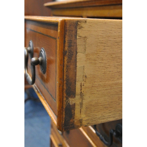 245 - A REPRODUCTION YEW WOOD TALL CHEST OF EIGHT ASSORTED DRAWERS, with a single brushing slide, raised o... 