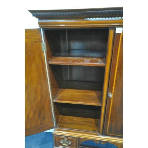 246 - A MAPLE AND CO LIMITED MAHOGANY CABINET, the double doors enclosing shelves, above three assorted dr... 