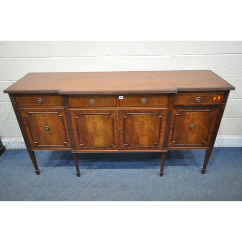 252 - A REPRODUCTION MAHOGANY BREAKFRONT SIDEBOARD, fitted with four drawers, above four cupboard doors, r... 