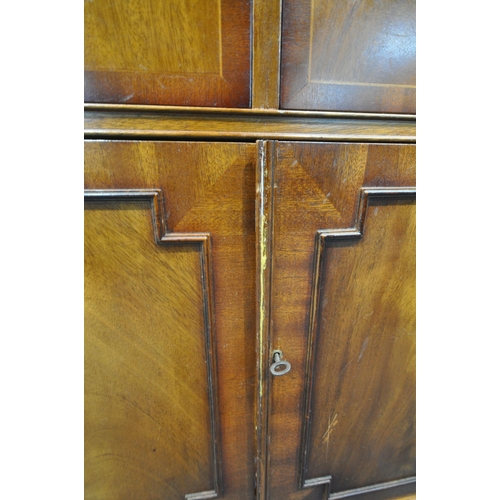 252 - A REPRODUCTION MAHOGANY BREAKFRONT SIDEBOARD, fitted with four drawers, above four cupboard doors, r... 