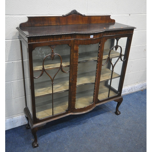 254 - AN EARLY 20TH CENTURY MAHOGANY TWO DOOR CHINA CABINET, with a domed centre glass, on ball and claw f... 