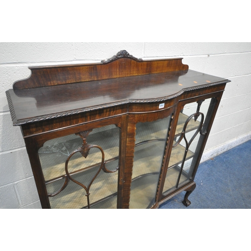 254 - AN EARLY 20TH CENTURY MAHOGANY TWO DOOR CHINA CABINET, with a domed centre glass, on ball and claw f... 