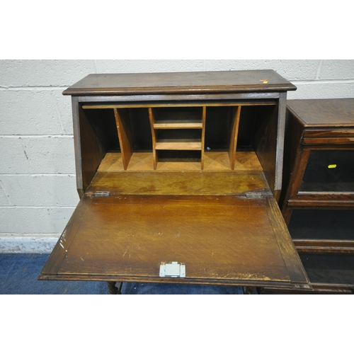 258 - A 20TH CENTURY OAK BOOKCASE, with three hide and fall glass doors, width 90cm x depth 29cm x height ... 