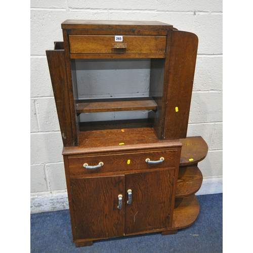 265 - AN ART DECO OAK SIDE TABLE, with a double sided drawer, shelves to one end, and a magazine rack to t... 