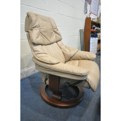 272 - A EKORNES STRESSLESS BROWN LEATHER SWIVEL RECLINING ARMCHAIR, with a matching footstool, condition r... 