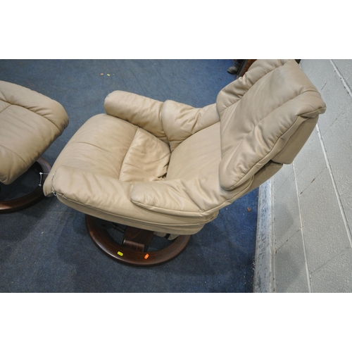 272 - A EKORNES STRESSLESS BROWN LEATHER SWIVEL RECLINING ARMCHAIR, with a matching footstool, condition r... 