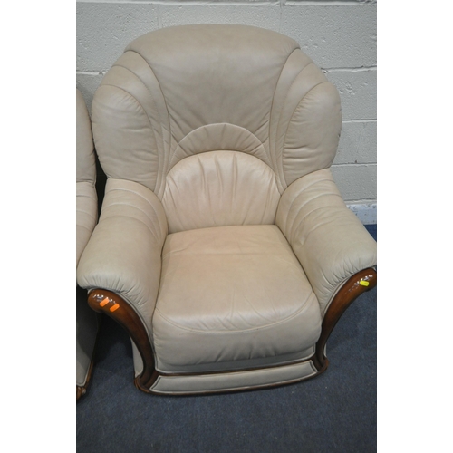 273 - A SET OF THREE CREAM LEATHER ARMCHAIRS, along with a matching footstool, condition report: in need o... 