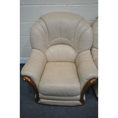 273 - A SET OF THREE CREAM LEATHER ARMCHAIRS, along with a matching footstool, condition report: in need o... 