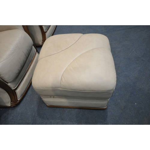 273 - A SET OF THREE CREAM LEATHER ARMCHAIRS, along with a matching footstool, condition report: in need o... 