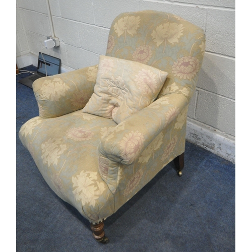 274 - A VICTORIAN ARMCHAIR, with William Morris style upholstery, raised on walnut legs, with castors, con... 