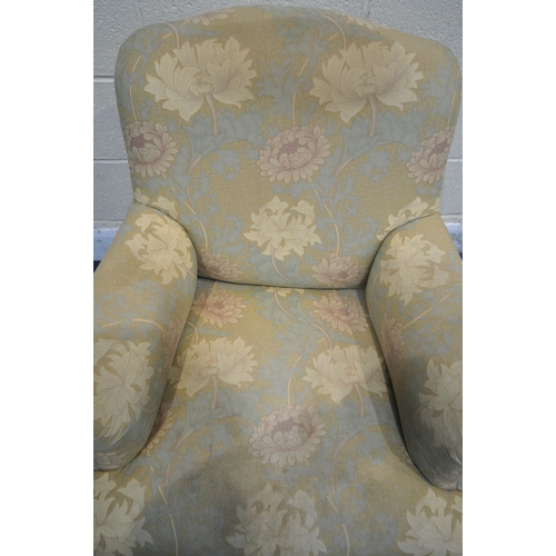 274 - A VICTORIAN ARMCHAIR, with William Morris style upholstery, raised on walnut legs, with castors, con... 