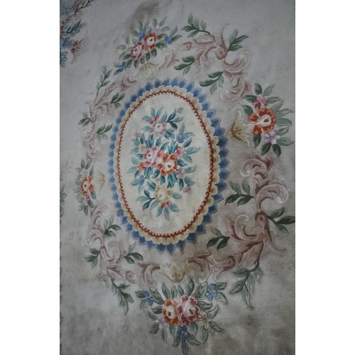 277 - A LARGE CREAM GROUND CHINESE RUG, with a central design, repeating patterns, 379cm x 274cm, conditio... 