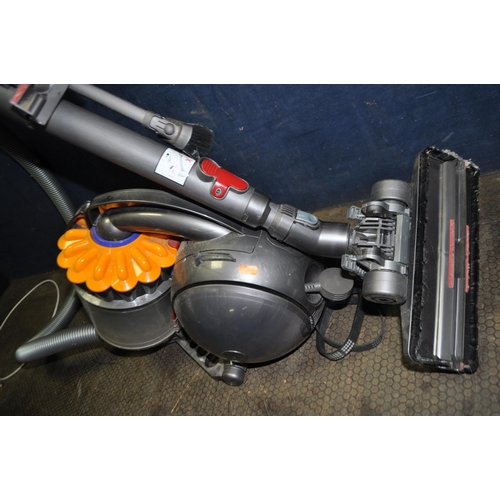 73 - A DYSON DC28C VACUUM CLEANER with two attachments and an unbranded steam mop (both PAT pass and work... 