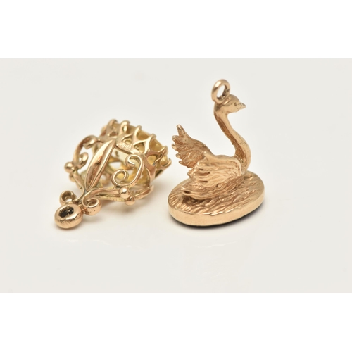 405 - TWO 9CT GOLD CHARMS, the first a swan shaped fob seal, set with a polished onyx inlay, hallmarked 9c... 